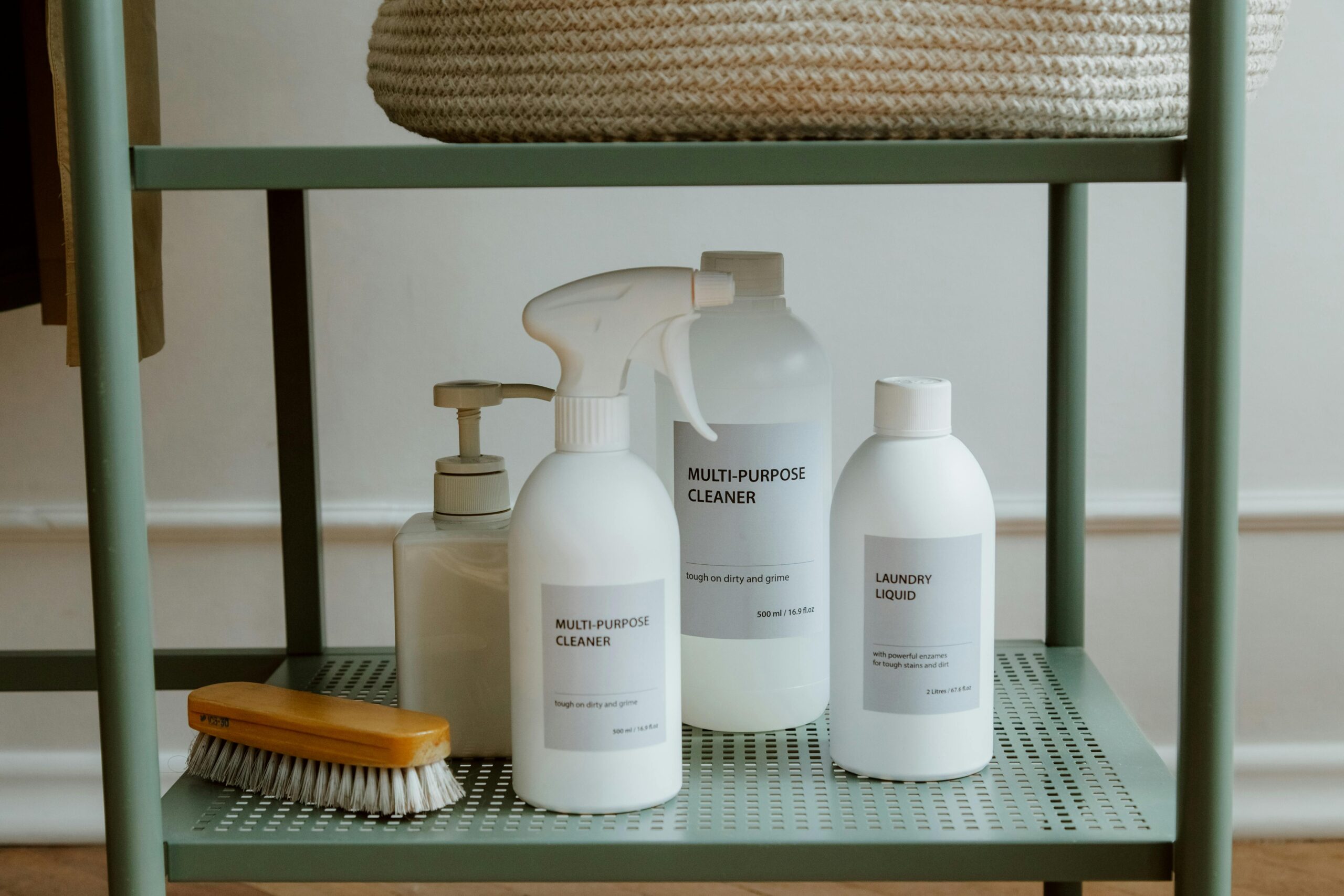 Top Storage & Organization Products for Indian Homes (Space-Saving Tips) A minimalist display of cleaning products on a shelf, perfect for home organization themes.