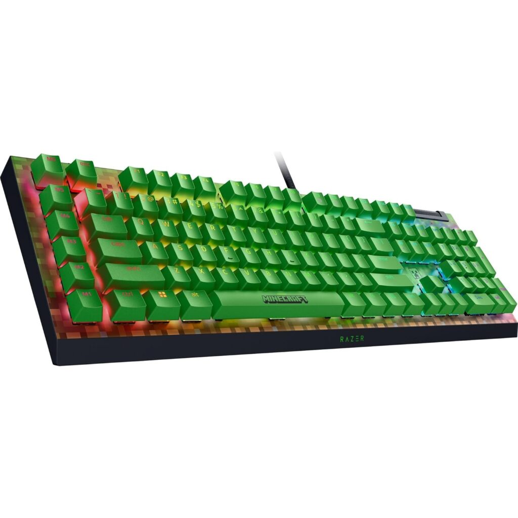 Green RGB mechanical gaming keyboard with illuminated keys and Razer branding, featuring a colorful backlit base and wired connection.